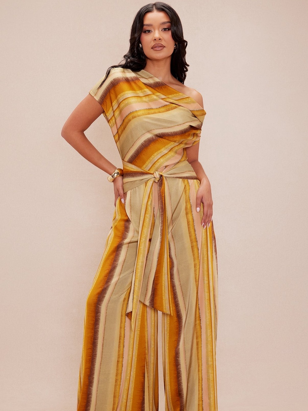 NOVA LUXE Striped One-Shoulder Jumpsuit in Mustard and Beige